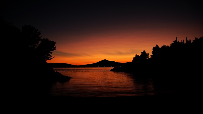 sunset, hill, orange, water, trees, dark, calm, silhouette, nature